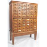 An exceptional early 20th century large Industrial oak index filing cabinet on stand. Raised on a