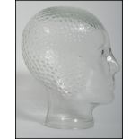 A 20th century art deco style moulded pressed glass phrenology type head - shop display stand /