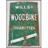 An original early 20th century enamel advertising sign for Wills Woodbine Cigarettes The sign