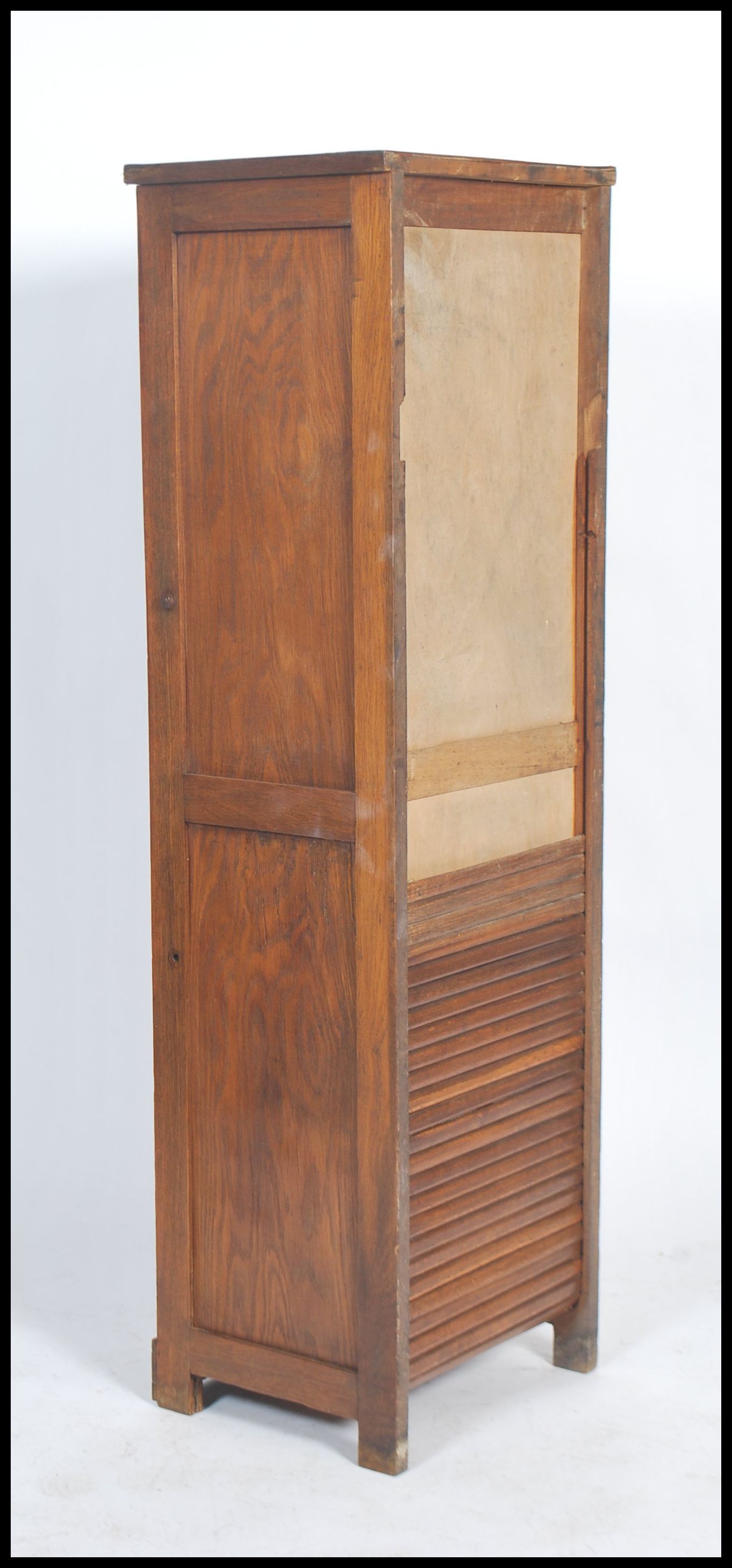 A 1920's oak tall  tambour fronted office Industrial filing cabinet raised on plinth base with - Image 4 of 4