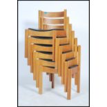 A set of 6 beech and vinyl upholstered stacking and interlocking chairs by Clive Bacon dating to the