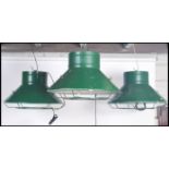A set of three vintage 20th century oversized industrial factory pendant ceiling lights, finished