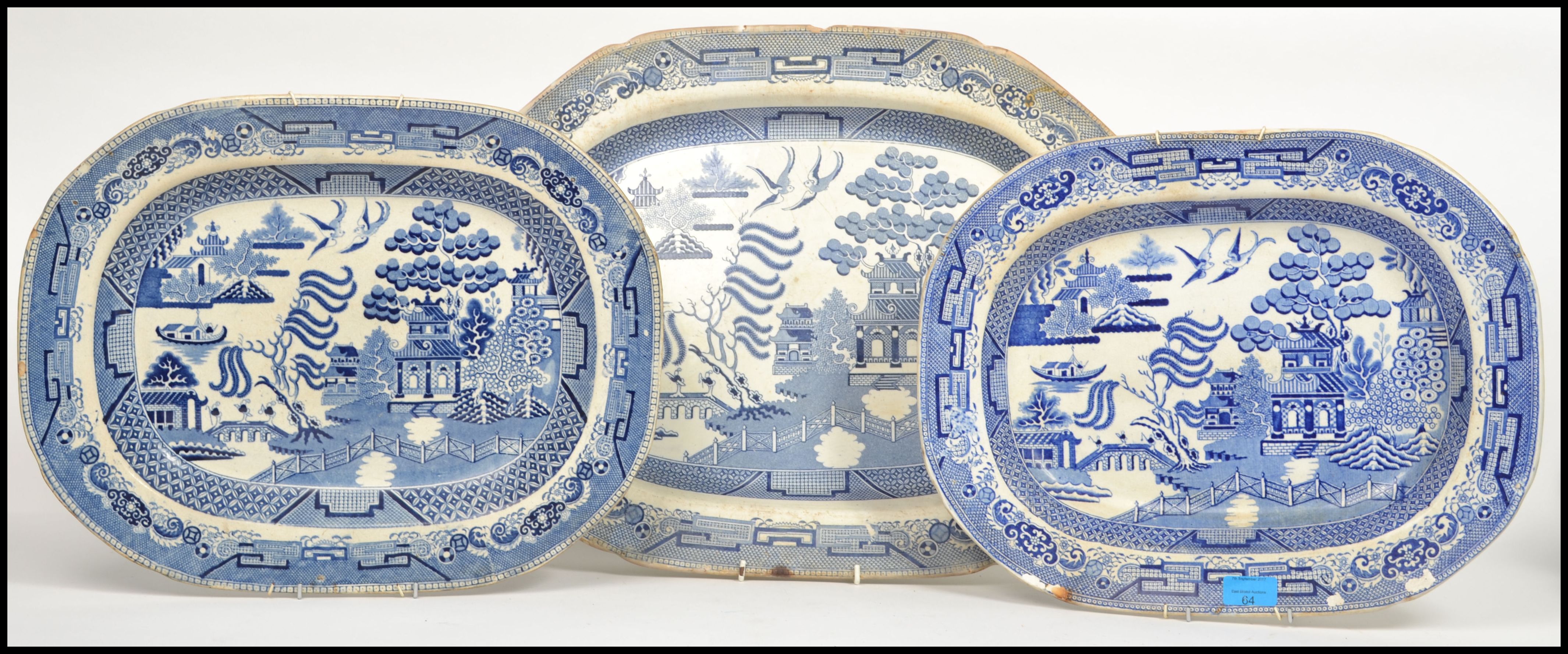 A collection of 3 blue and white willow pattern me
