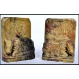 A pair of Chinese carved soapstone bookends, each