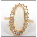 A yellow gold substantial opal and diamond cluster