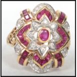 An 18ct yellow gold ladies ruby and diamond ring c