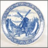 A 20th century Delft ceramic wall hanging charger