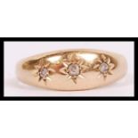 An antique 18ct gold  and diamond gypsy setting ri
