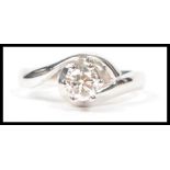 An 18ct white gold and diamond solitaire ring of f