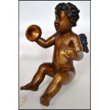 An early 20th century bronze cherub winged putti m