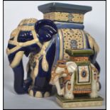 A Chinese 20th century ceramic elephant plant stan