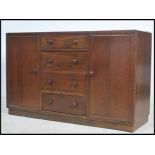 A 20th century vintage dark wood sideboard with a