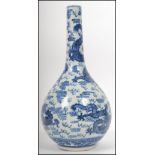 A 19th century Kang-xi blue and white vase being d