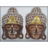 A pair of Indonesian carved wooden decorative wall
