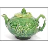 A 19th century Oriental ceramic Yi Xing tea pot of globular form having a green textured