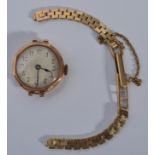 A vintage 20th century 9ct gold ladies cocktail watch set on a 9ct watch bracelet. Total weight 19.7