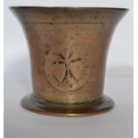 A heavy bronze mortar dating to the late 17th early 18th century with indistinct heraldic device