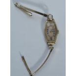 A 1930's Art Deco 14ct white gold ladies cocktail / dress watch having lozenge shaped case with