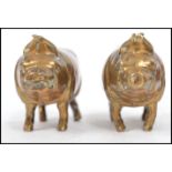 A pair of 19th century Victorian lead filled brass novelty pig paperweights. Measures: 4cm high x