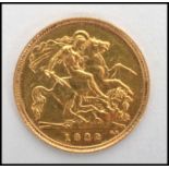 A 20th century gold half sovereign coin dating to 1982,  weighs 3.99 grams. Measures 2 cm diameter.