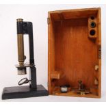 A late 19th / early 20th century Victorian boxed scientific microscope. Brass construction, the