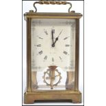 A 20th century German brass cased glass panel carriage clock by Schatz and Sohne having a two