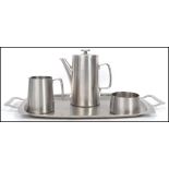 A vintage 20th century retro Old Hall stainless steel coffee service comprising of coffee pot, sugar