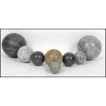 A collection of 20th century large marble carved balls - spherical globes of varying sizes and