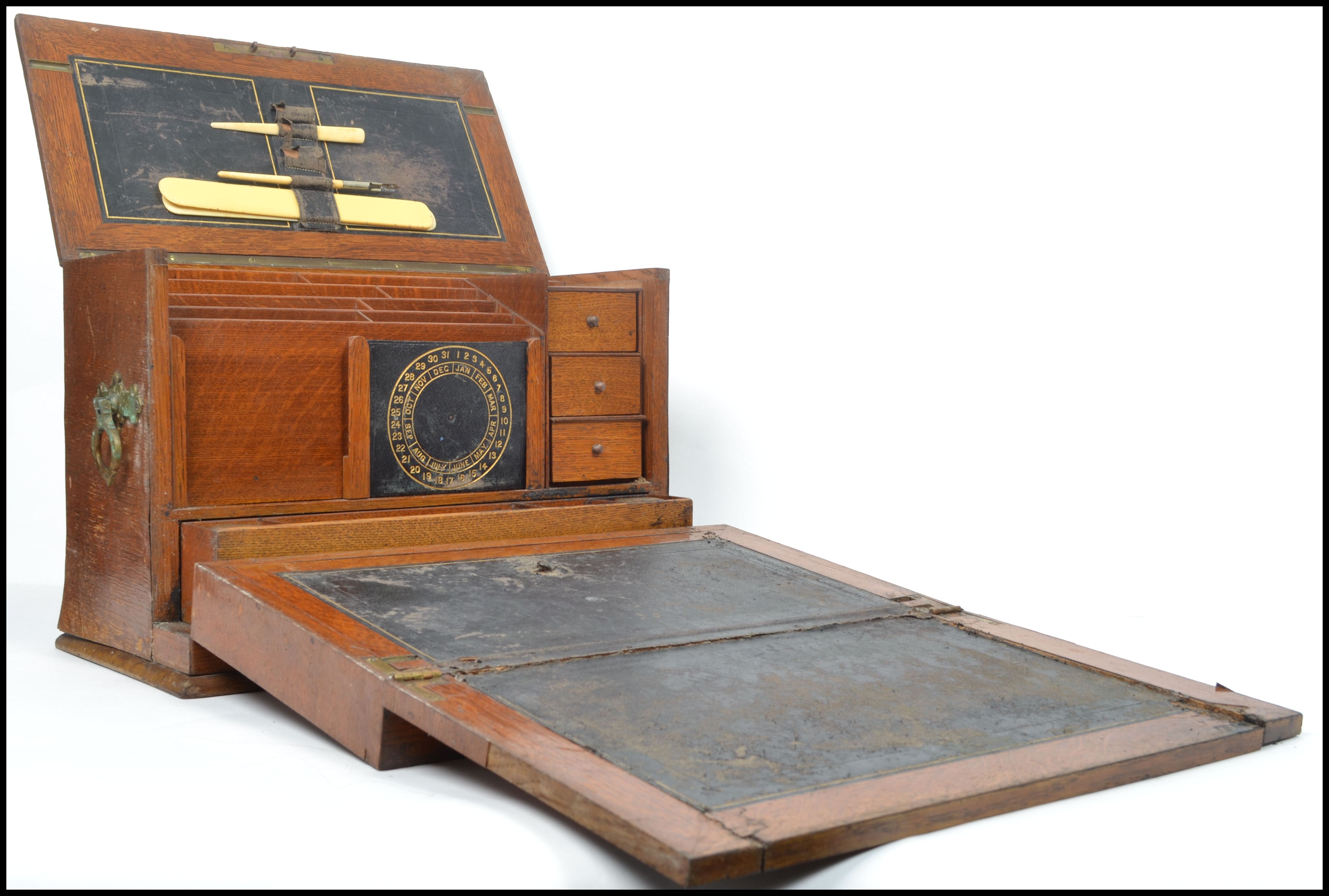 A very good early 20th century  Edwardian oak metamorphic desk tidy / stationery box. Pull action