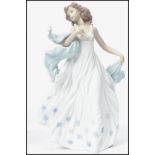 A Lladro ceramic figurine of a lady entitled ' Summer Serenade ' with impressed marks to base