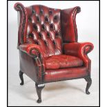 A stunning Queen Anne style oxblood leather cheste