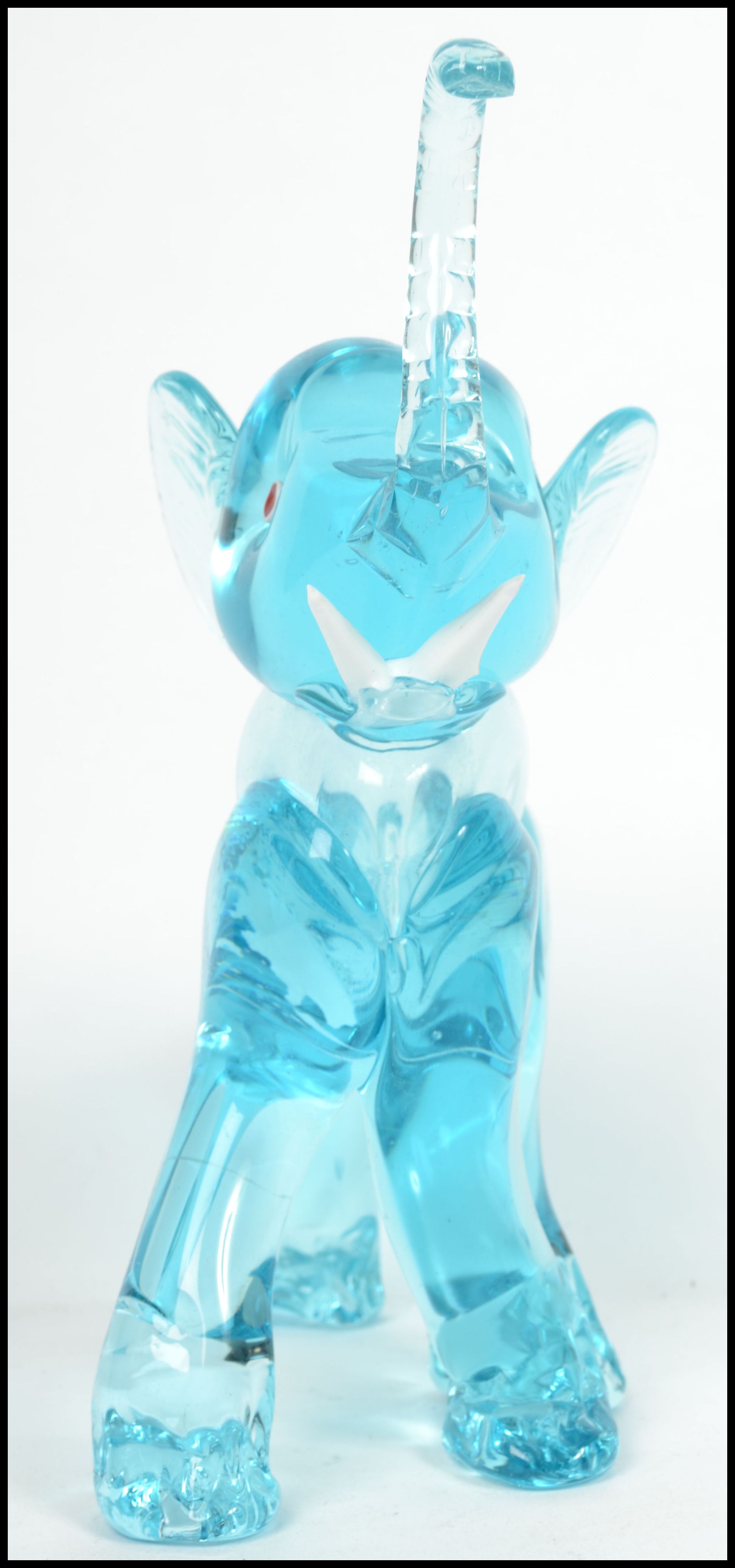 An unusual 20th century / 1960's retro glass elephant figurine. Blue glass with colourful eyes and - Image 2 of 4