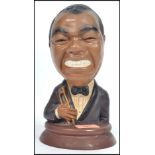 A retro 20th century circa 1970's chalk-ware bust of Louis Armstrong, painted finish with original