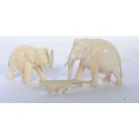 A group of three 19th century ivory carvings, two in the form of elephants and on miniature