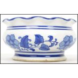 A 19th century Oriental ceramic blue and white incense bowl having a flared scalloped rim and