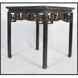 A 19th century Chinese lacquered and chinoserie decorated centre table. Painted black with gilt