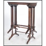 A Regency 19th century rosewood harlequin nest of tables, each of graduating size being raised on