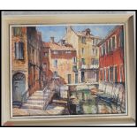 A vintage 20th century oil on board painting of a river side street scene signed by artist Gordon