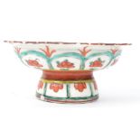 An Oriental Chinese raised tazza dish having a scalloped edge with hand painted floral and geometric