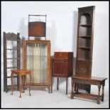 A collection of furniture to include an open bookcase, china cabinet, magazine rack, corner