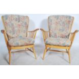A good pair of 20th century retro Ercol Windsor armchairs. The turned legs united by stretchers