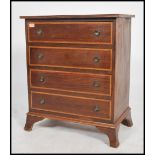 A 20th century Regency revival straight four bachelors chest of drawers. Each drawer fitted with