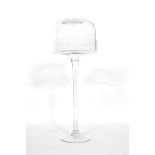 A vintage 20th century glass cake cloche stand of tall form, raised on a circular foot with tapering