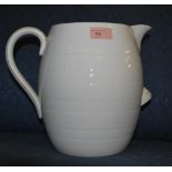 An early 20th century ceramic farmhouse cream milk dairy jug having a white glaze with banded