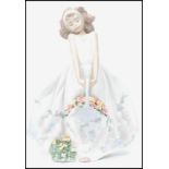 A Lladro ceramic figurine of a girl in dress holding a flower basket with floral bush to base.