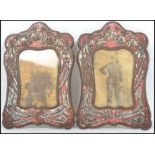 A pair of 19th century Art Nouveau easel back picture frames having a red ground with flowering