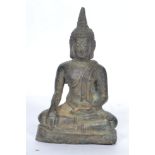 A 19th century Oriental bronze figure of a Buddha moulded in the lotus position rasied on a pedestal