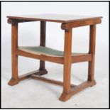 An arts & Crafts early 20th century monks bench table chair  with a sliding top/back, open arms