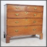 A Georgian mahogany 2 over 3 chest of drawers being ebony line inlaid with brass swing handles and