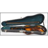 A vintage 20th century Czechoslovakian Stradivarius copy violin with label to interior complete in